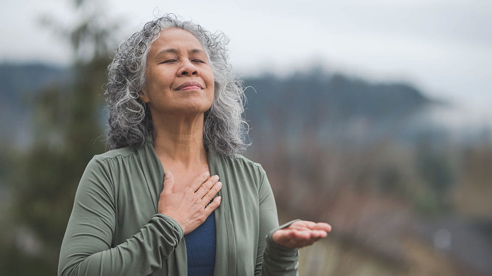 Breathing woman closing eyes